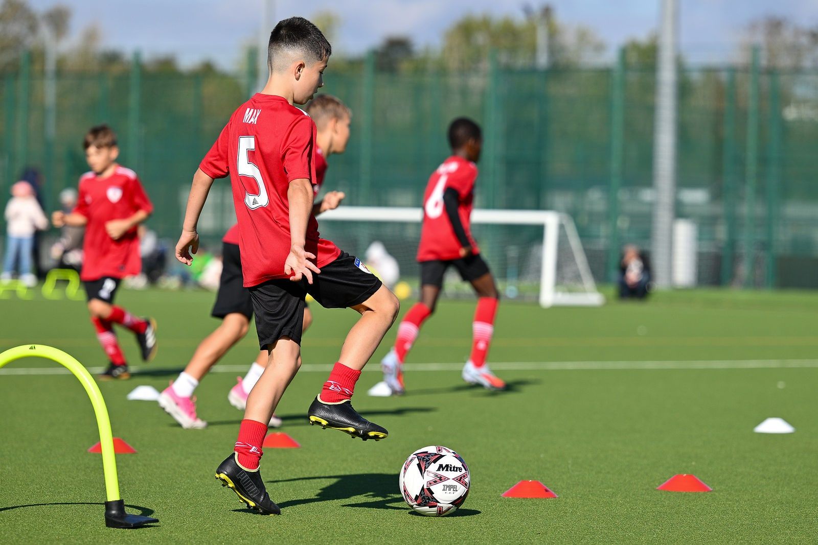 Players sprinting with resistance parachutes
