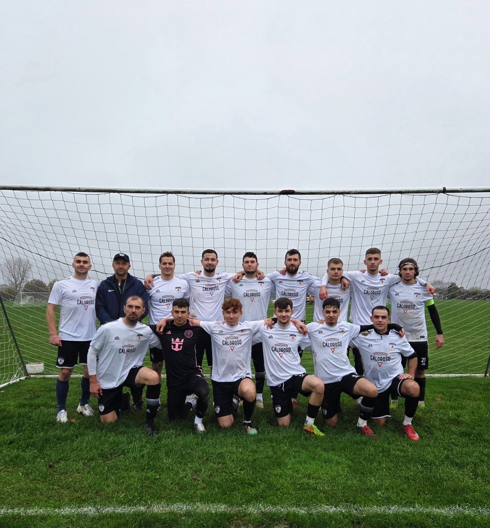 The FC Alpha senior team in their white Caloroso Pizza shirts after a win
