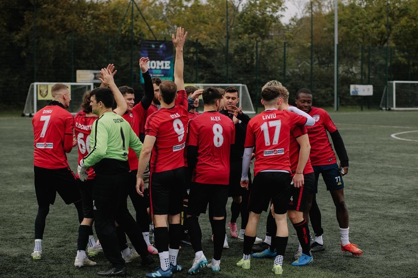 FC Alpha senior players celebrating together after a match