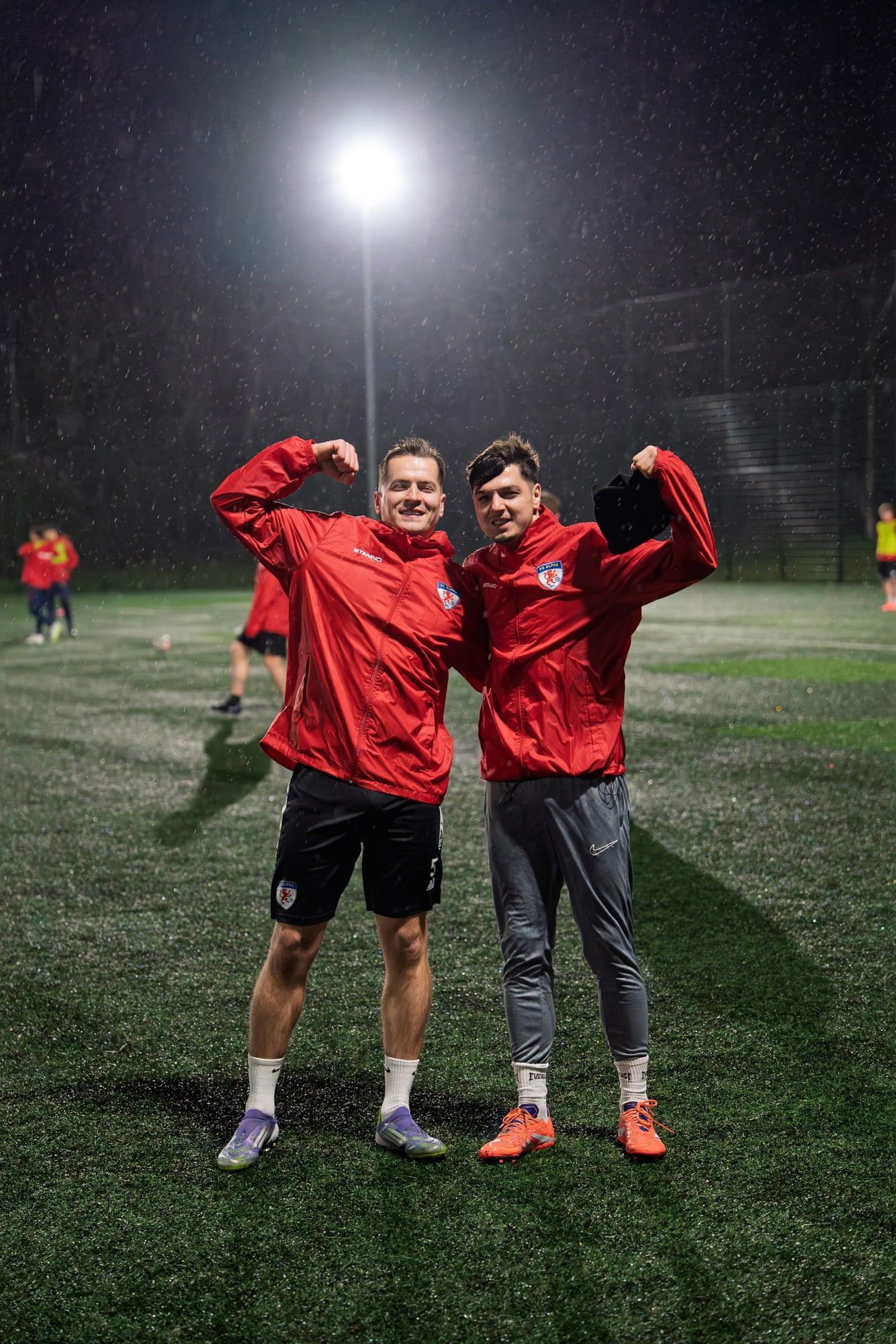 Two senior players celebrating together at the end of training