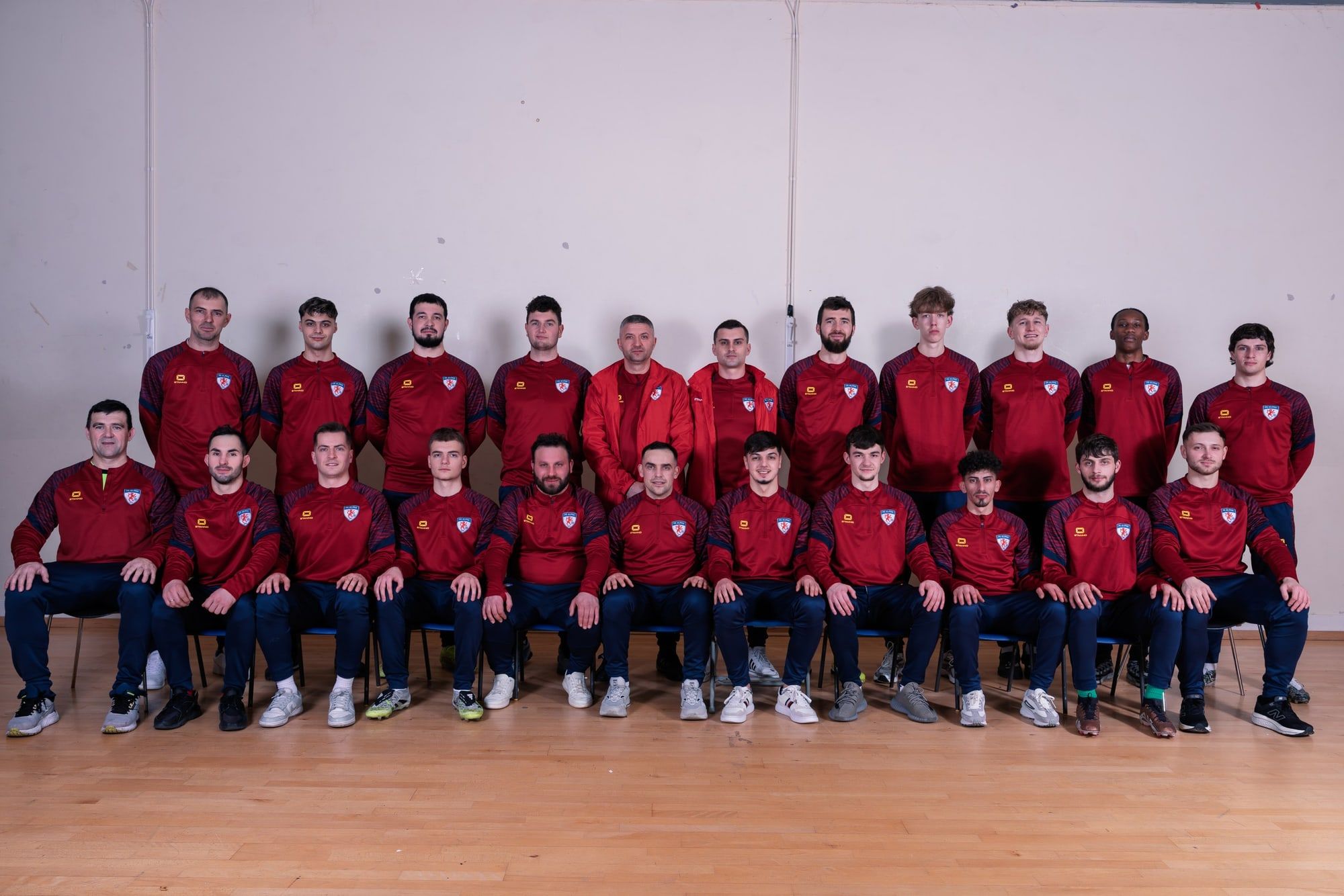The FC Alpha senior squad team photo indoors