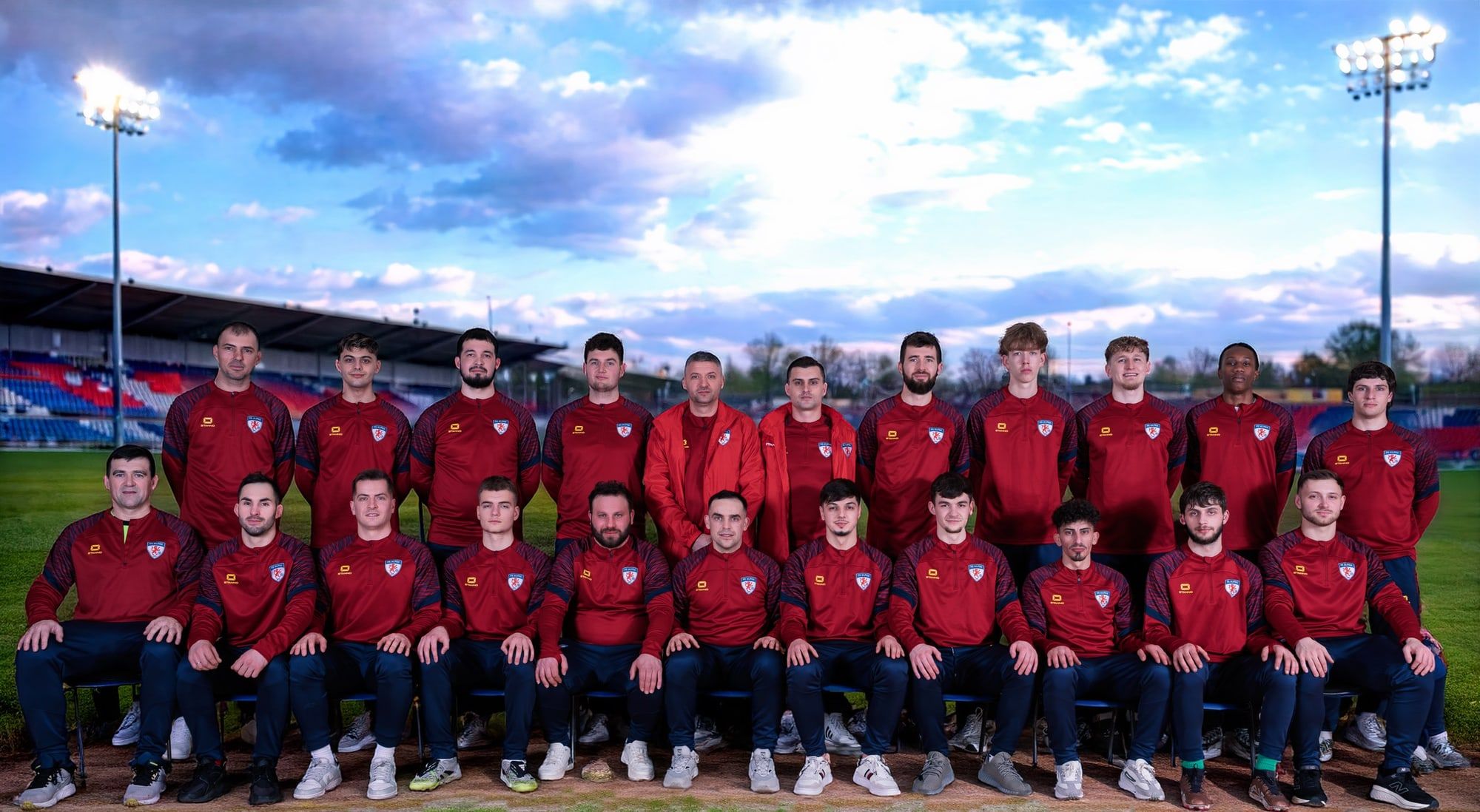 The FC Alpha senior squad in red club jackets