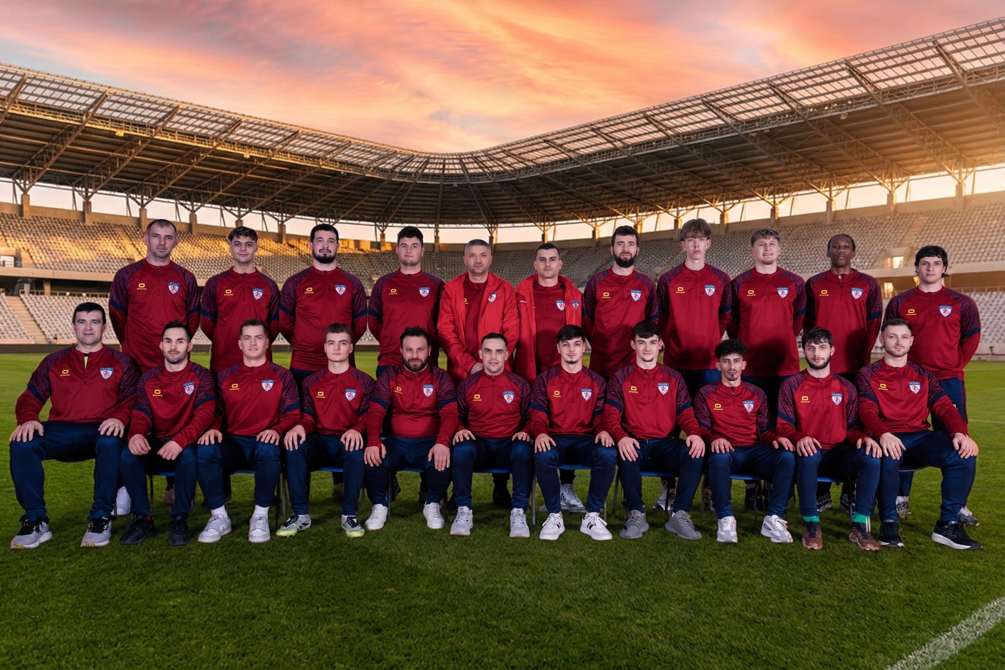 FC Alpha senior squad photo in red club jackets
