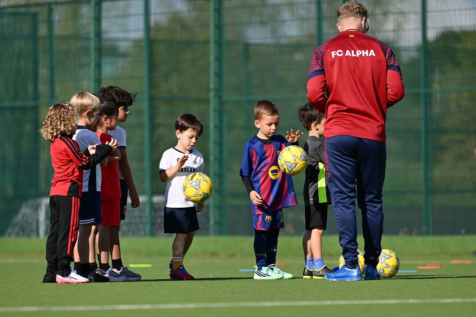Under 6 children playing football at FC Alpha Academy, Basildon