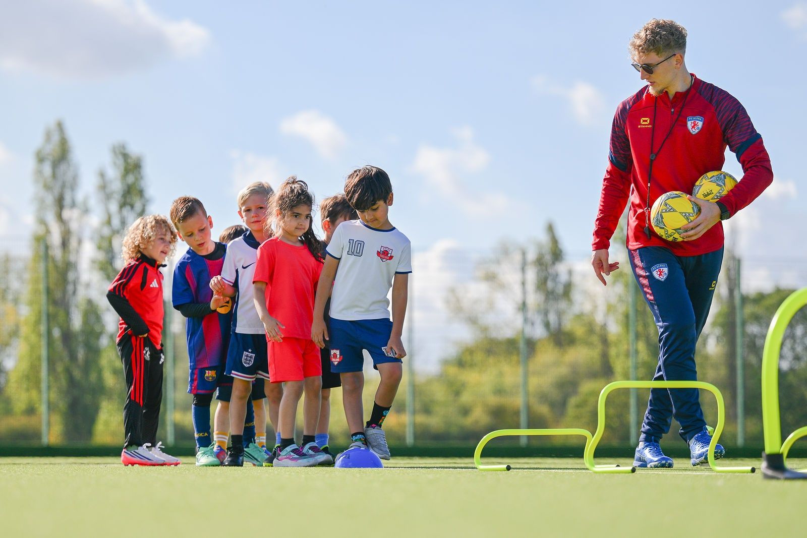Under 6 children playing football at FC Alpha Academy, Basildon